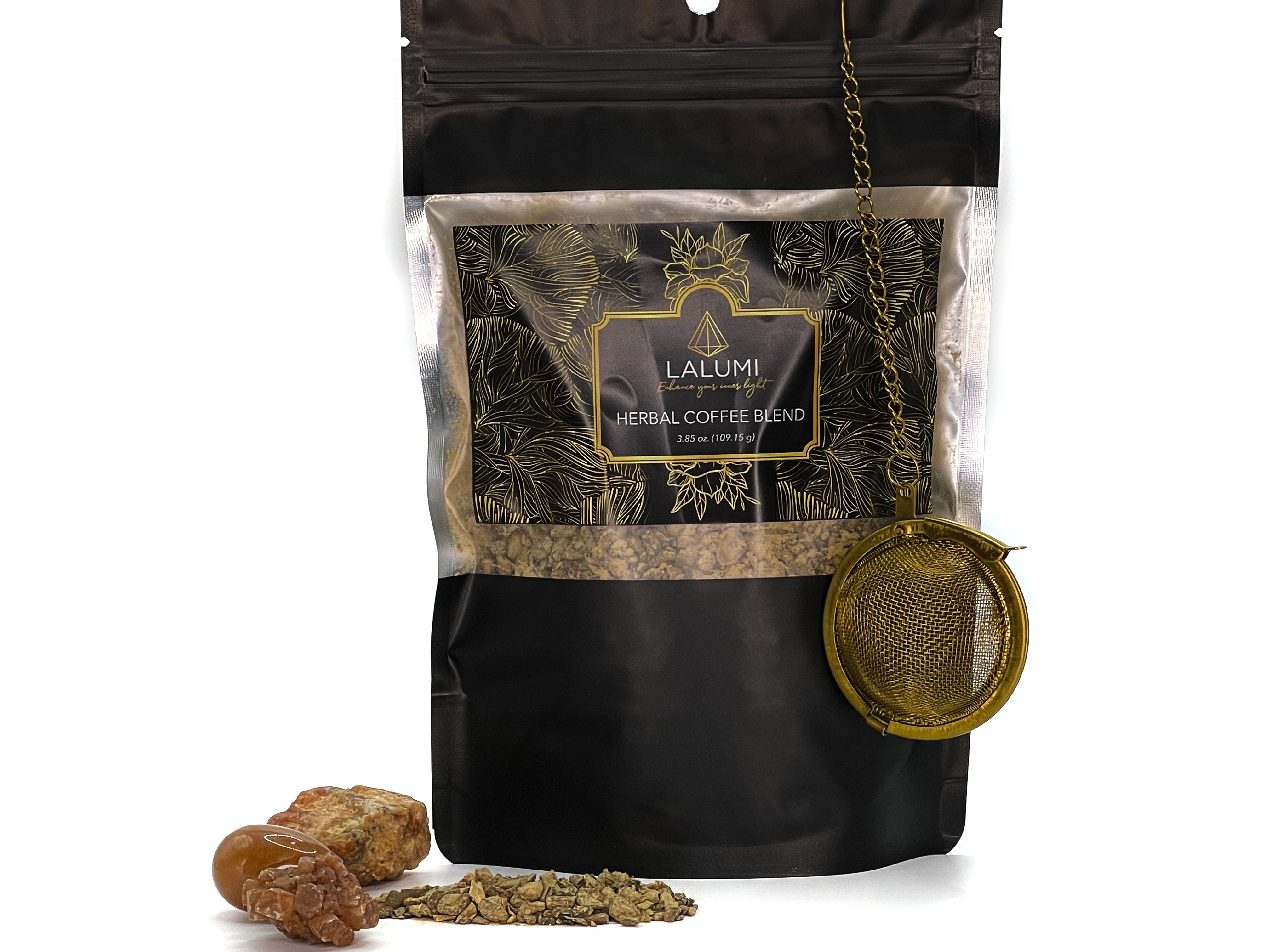 Image of Pouch of Organic Caffeine-Free Herbal Coffee Blend by LaLumi Herbes with a gold strainer and dried herbs on a white background