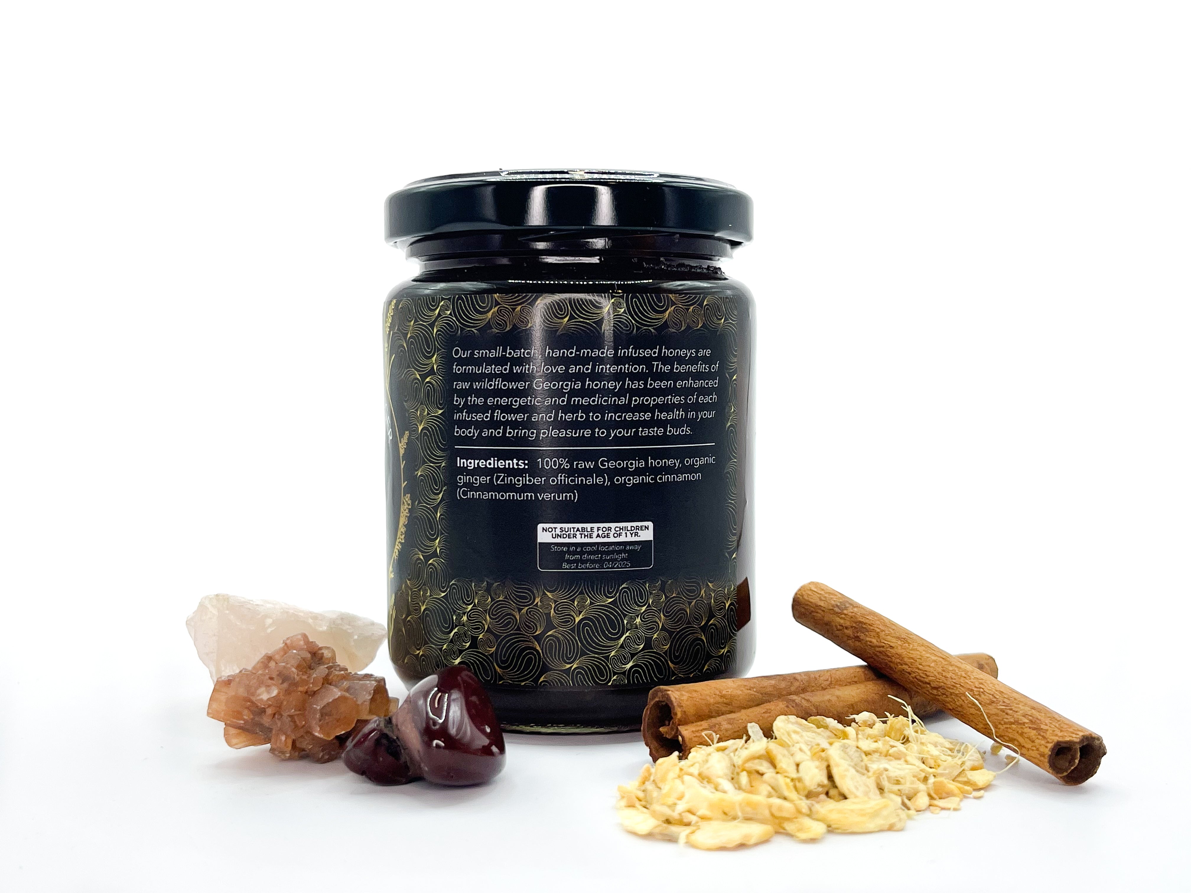 Image of 8 oz jar of Organic Cinnamon-Ginger Infused Local Honey by LaLumi Herbes with ingredients on a white background