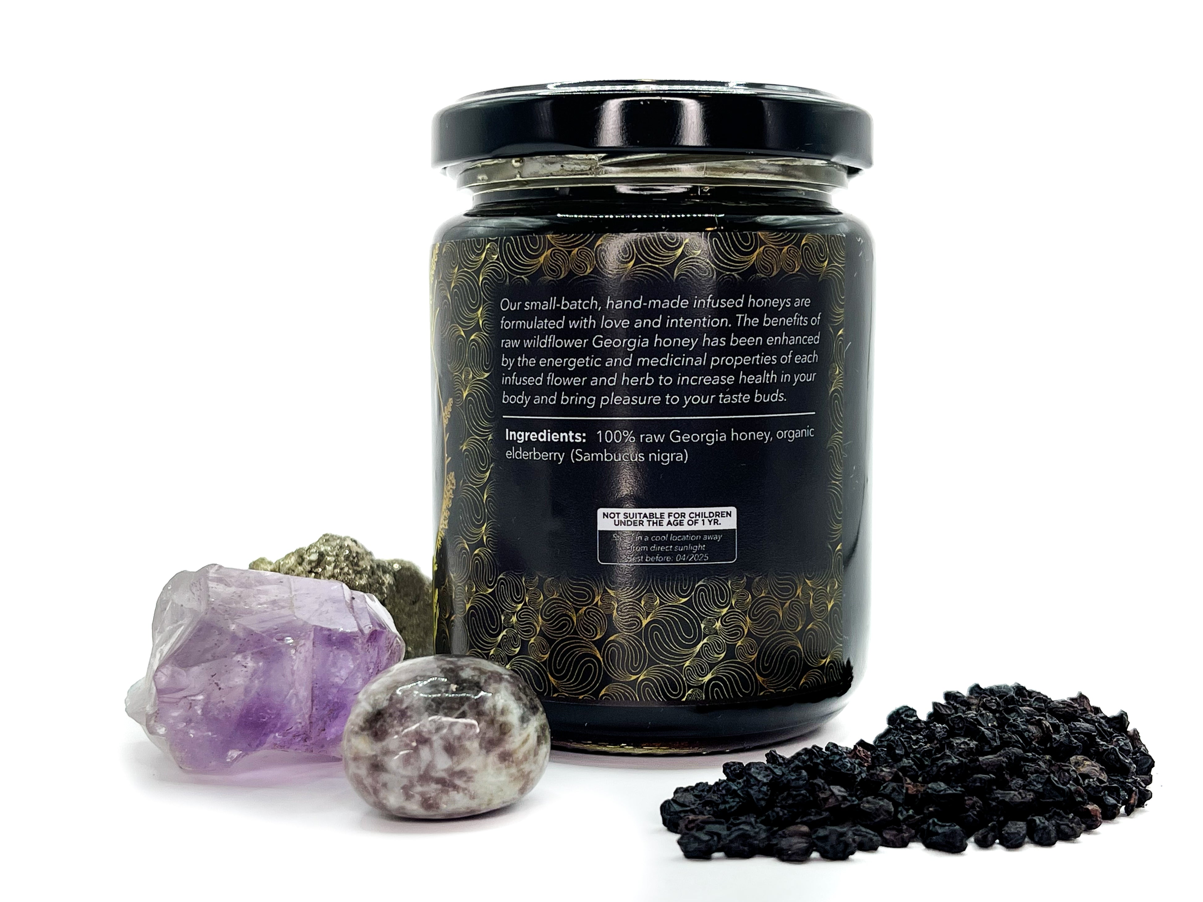 Image of 8 oz jar of Organic Elderberry Infused Local Honey by LaLumi Herbes surrounded by crystals on a white background