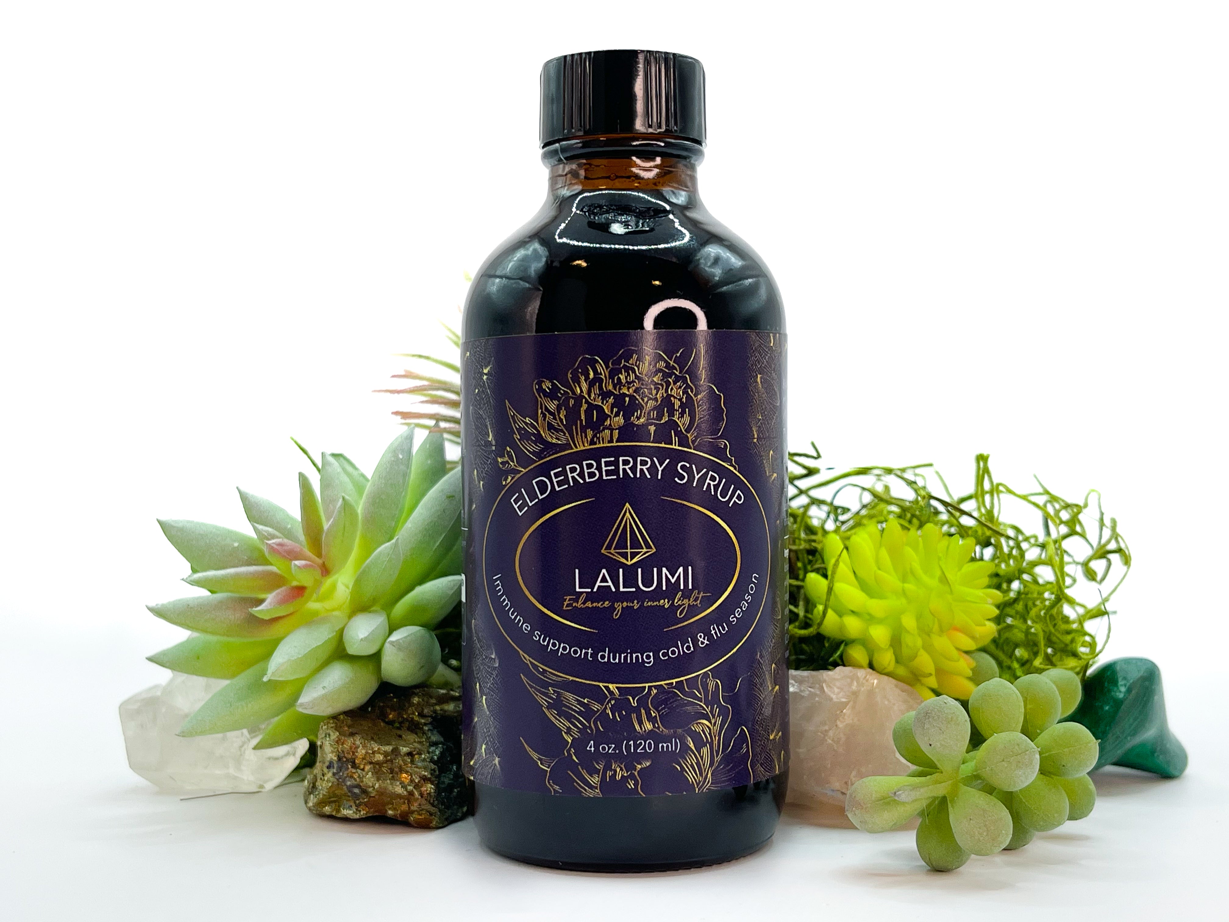 Image of 4 oz bottle of Elderberry Syrup by LaLumi Herbes with decorative plants on a white background