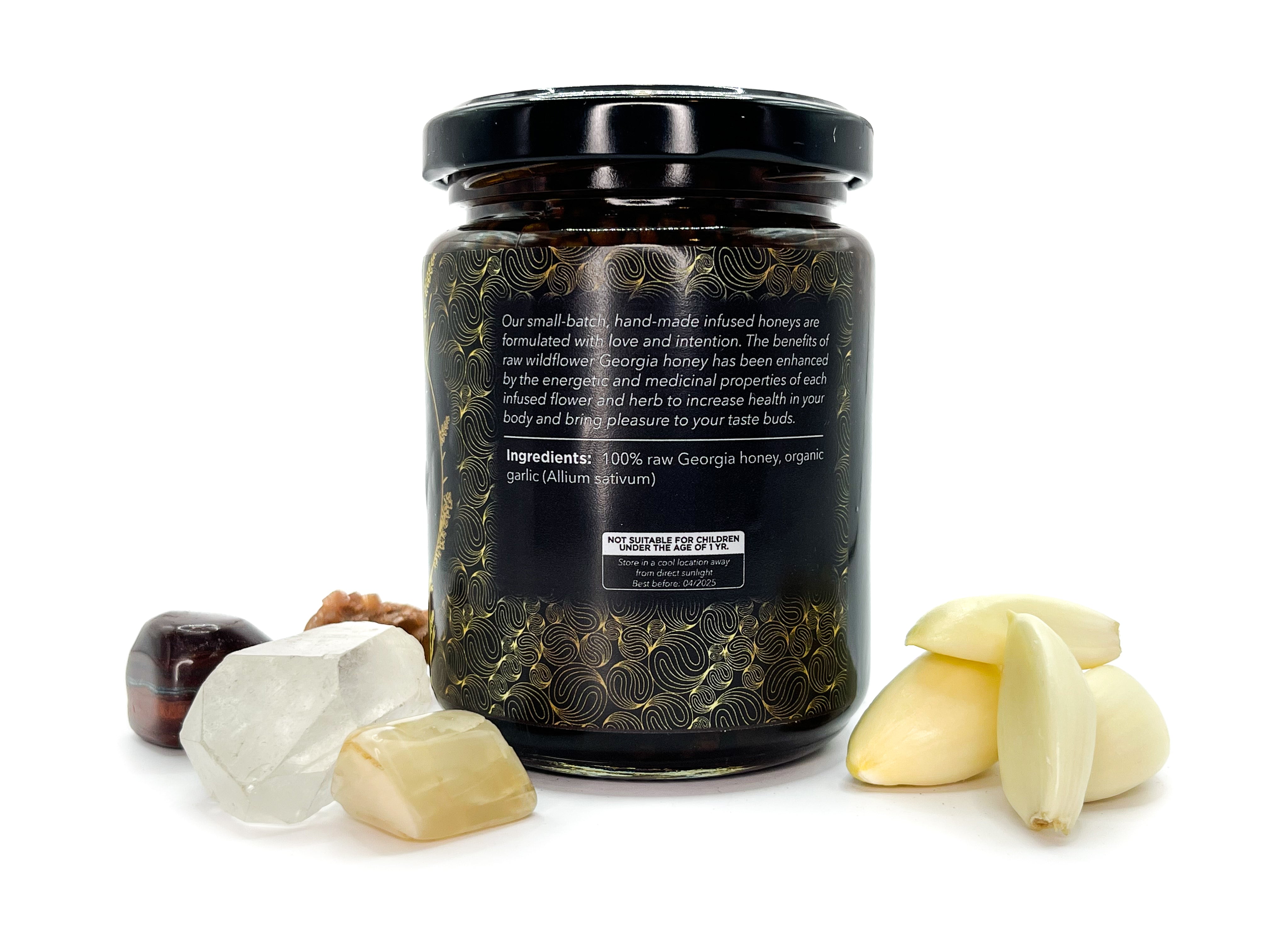 Image of Side view of 8 oz jar of Organic Garlic Infused Local Honey by LaLumi Herbes with ingredients displayed on a white background