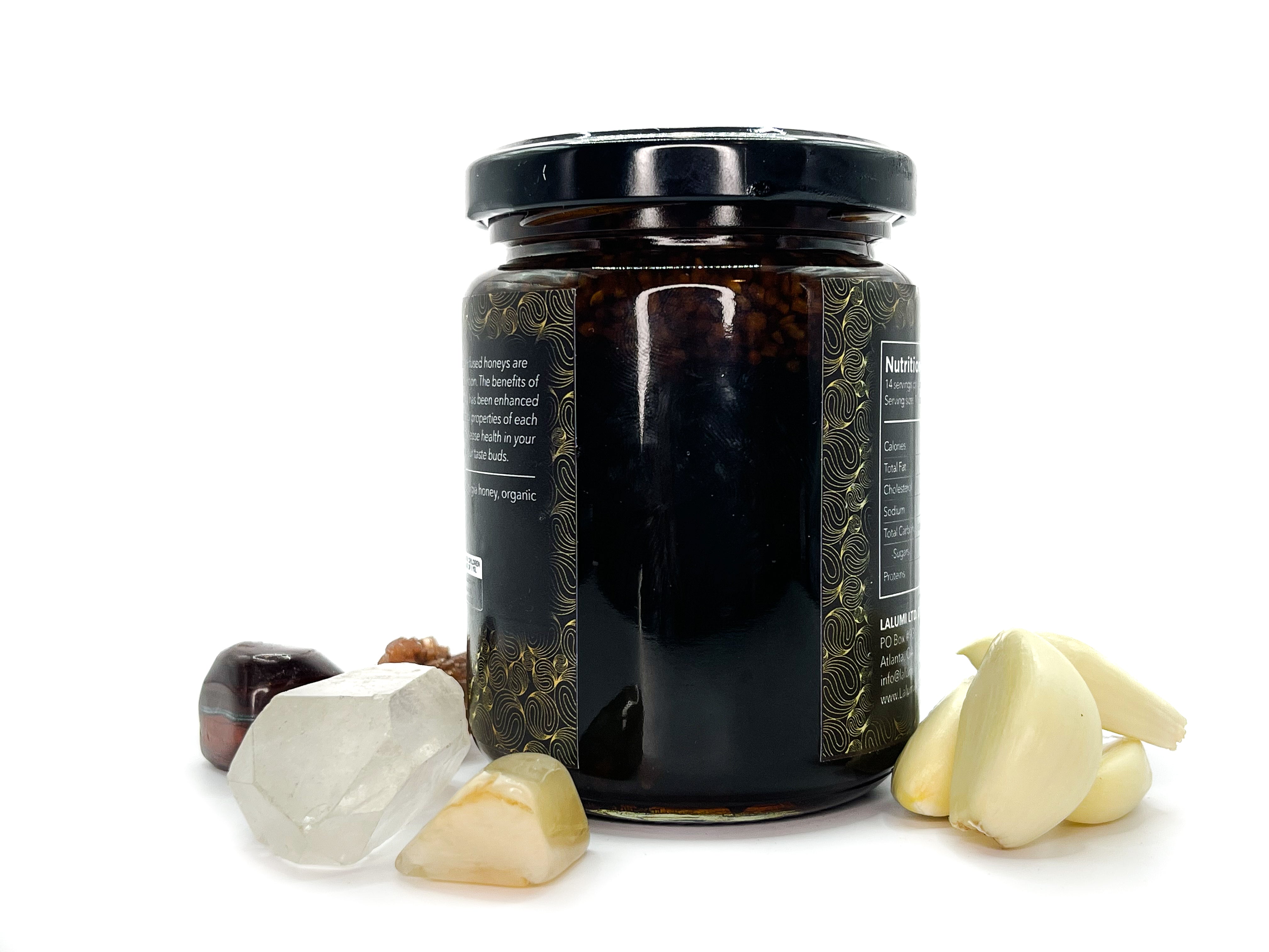 Image of 8 oz jar of Organic Garlic Infused Local Honey by LaLumi Herbes with garlic cloves and olives on a white background