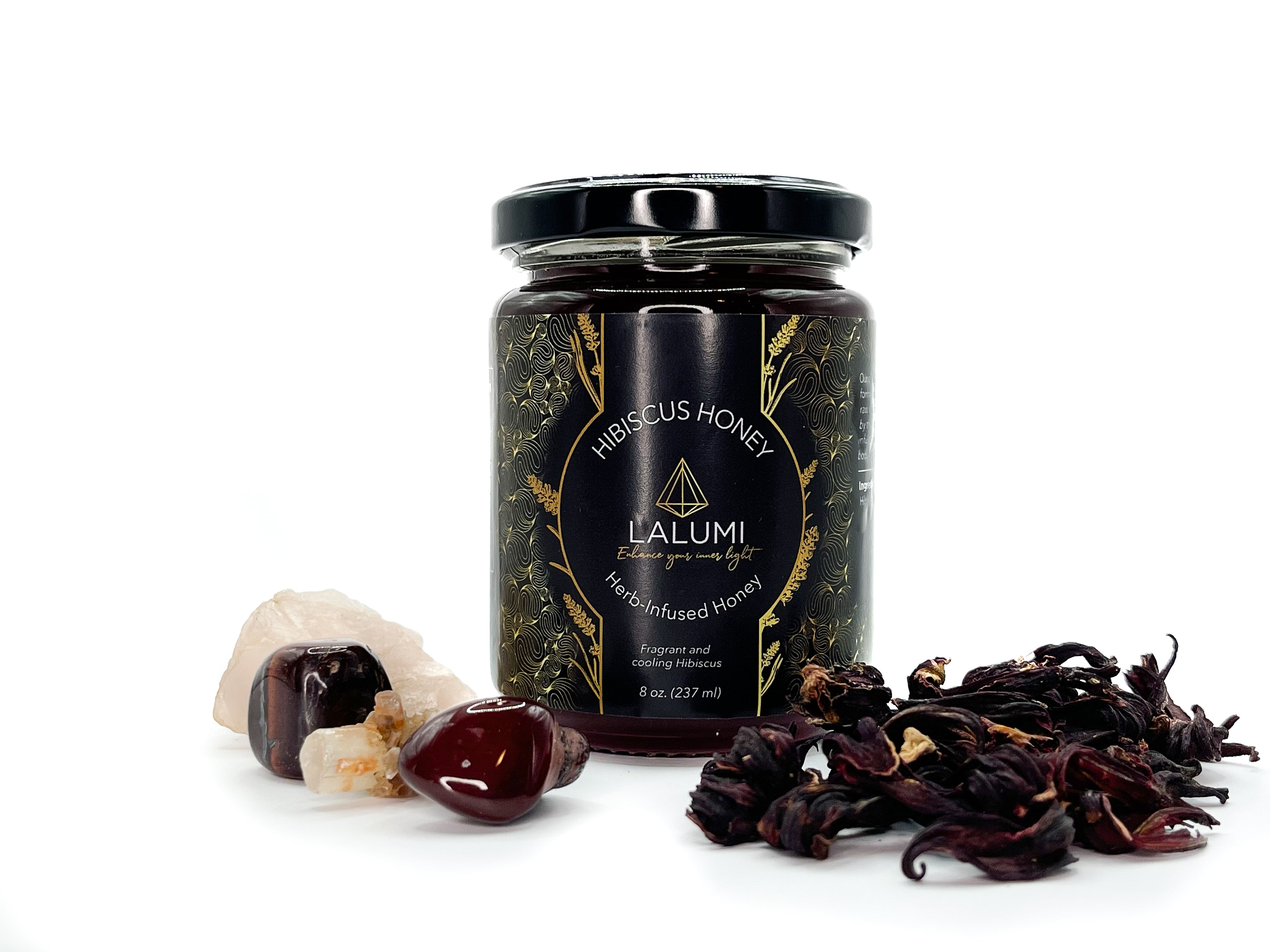 Image of 8 oz jar of Organic Hibiscus Infused Local Honey by LaLumi Herbes with dried hibiscus flowers and honey on a white background