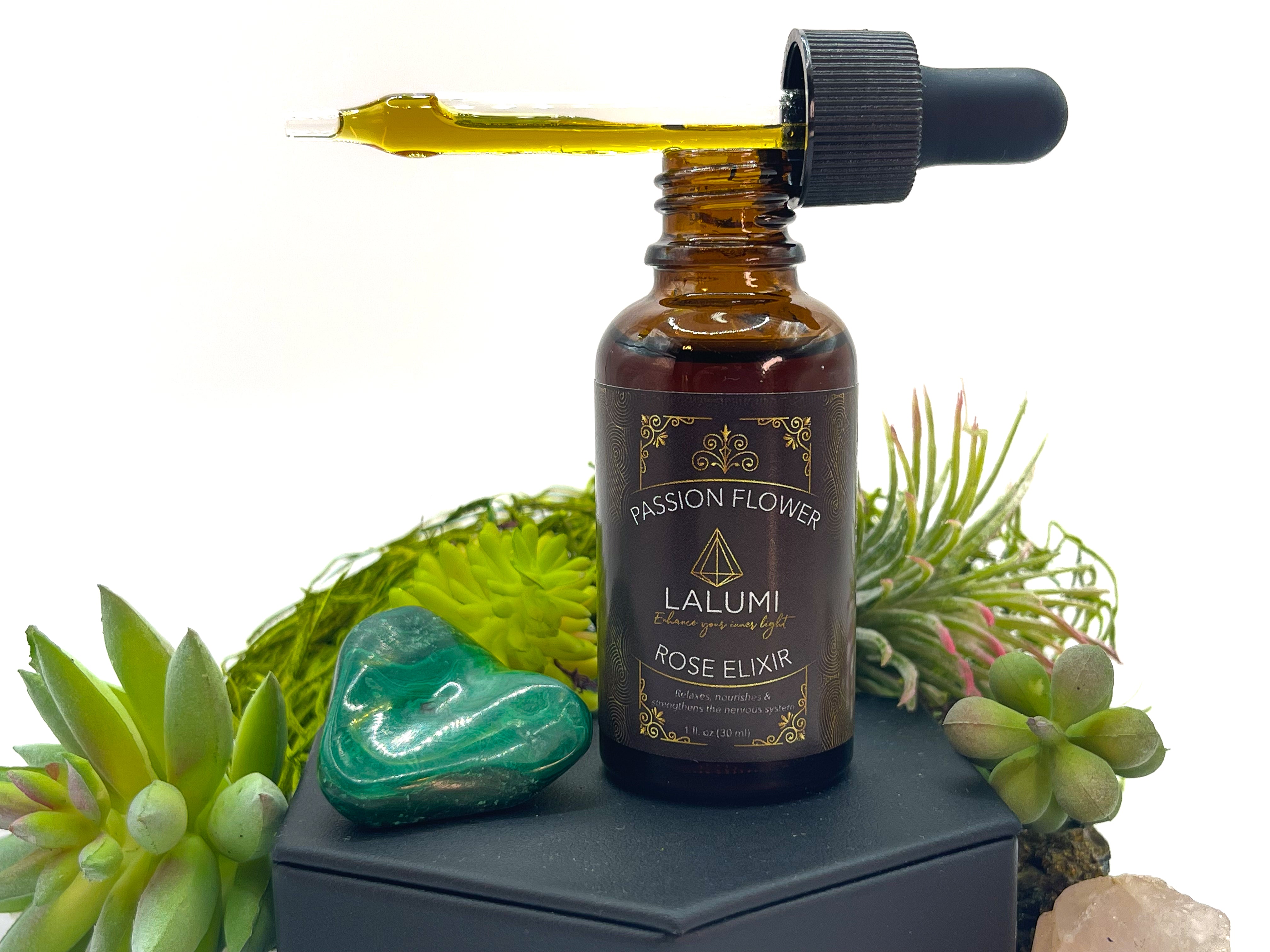 Image of 1 oz bottle of Wildcrafted Passionflower-Rose Herbal Elixir by LaLumi Herbes with a dropper on a white background